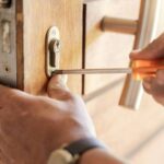 Locksmith hands, maintenance and handyman with tools, home renovation and fixing, change door locks